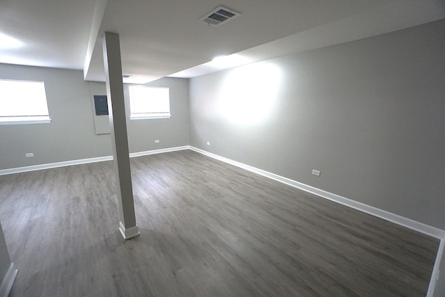 basement with dark wood-type flooring