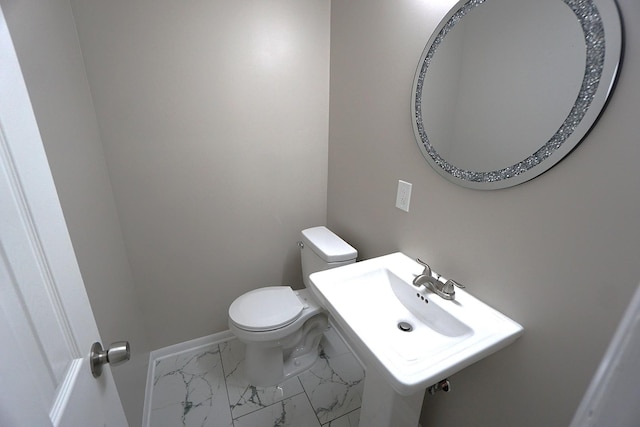 bathroom with sink and toilet