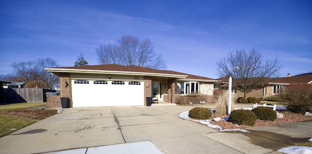 ranch-style home featuring a garage