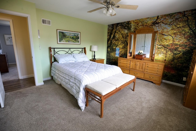 bedroom with ceiling fan and carpet floors