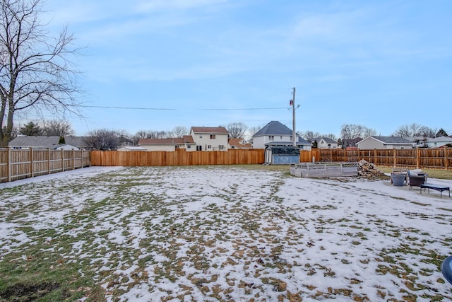 view of yard covered in snow