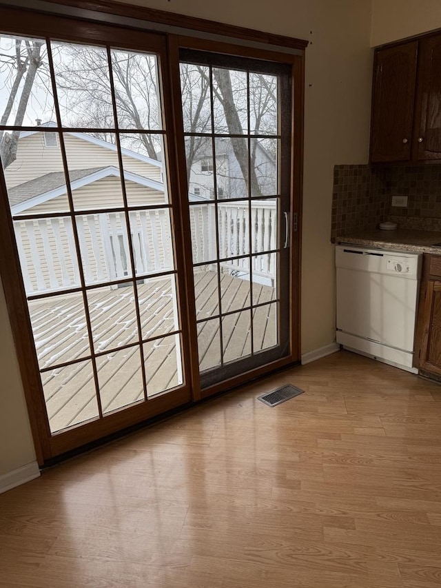 doorway to outside featuring light hardwood / wood-style floors