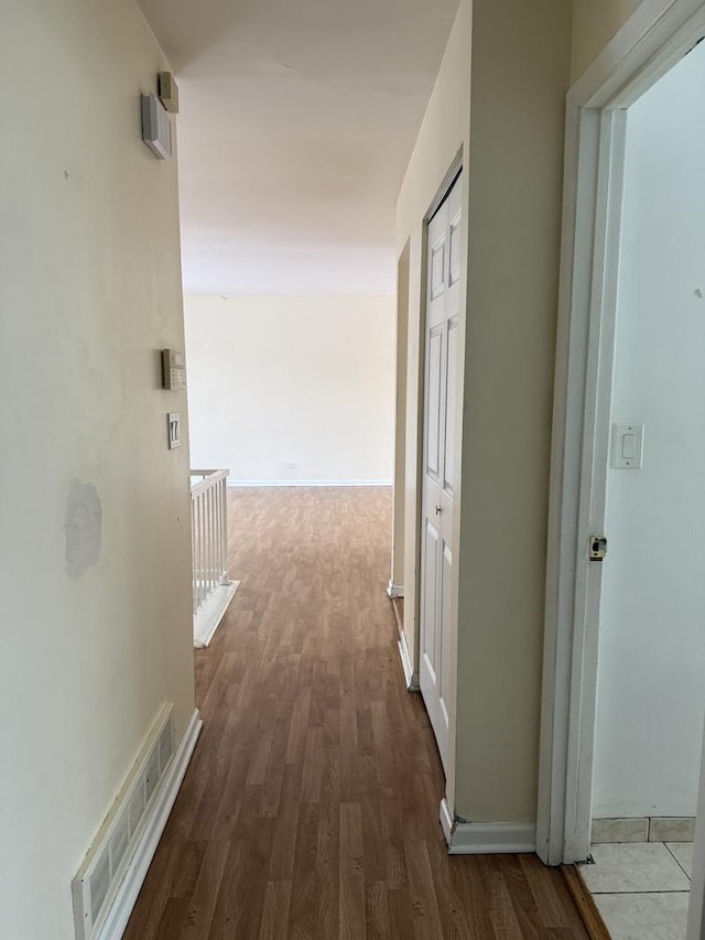 hallway featuring hardwood / wood-style flooring