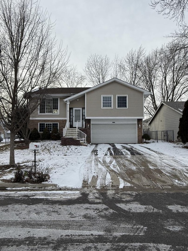 raised ranch featuring a garage