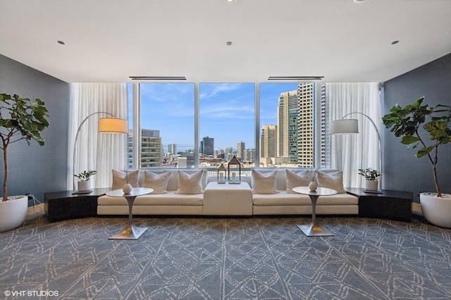 unfurnished living room featuring a view of city and floor to ceiling windows