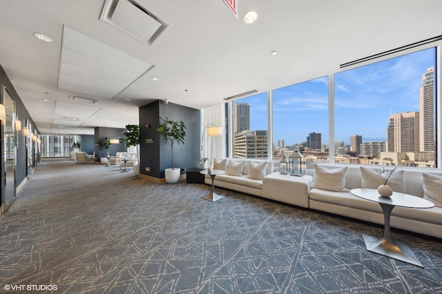 unfurnished living room with a wall of windows, a city view, and carpet flooring