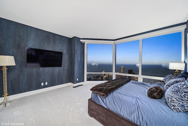 bedroom featuring carpet, visible vents, and baseboards