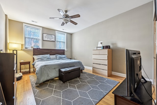 bedroom featuring dark wood-type flooring and ceiling fan