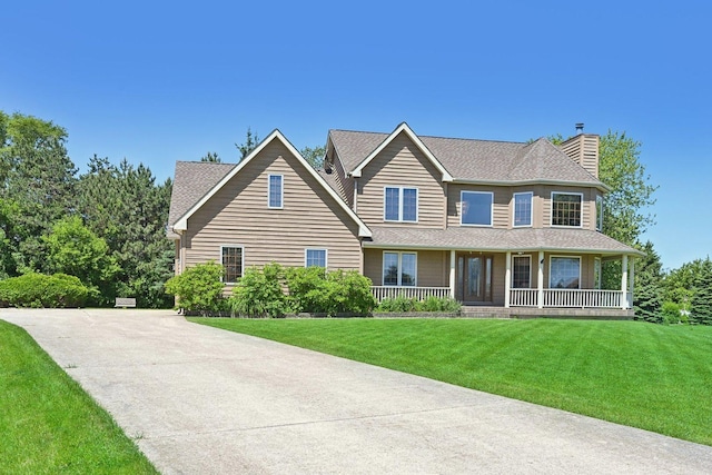 view of front of house featuring covered porch and a front lawn