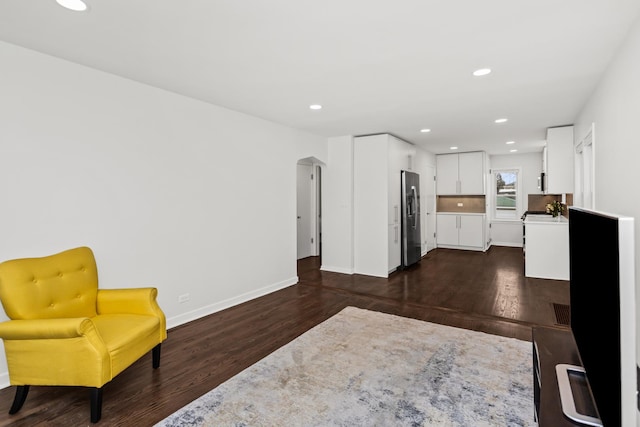 living area featuring dark wood-type flooring