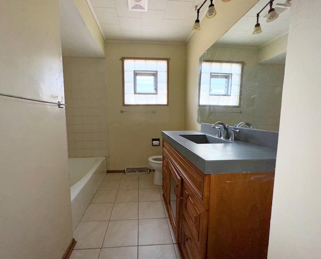 bathroom featuring crown molding, toilet, tile patterned flooring, and vanity