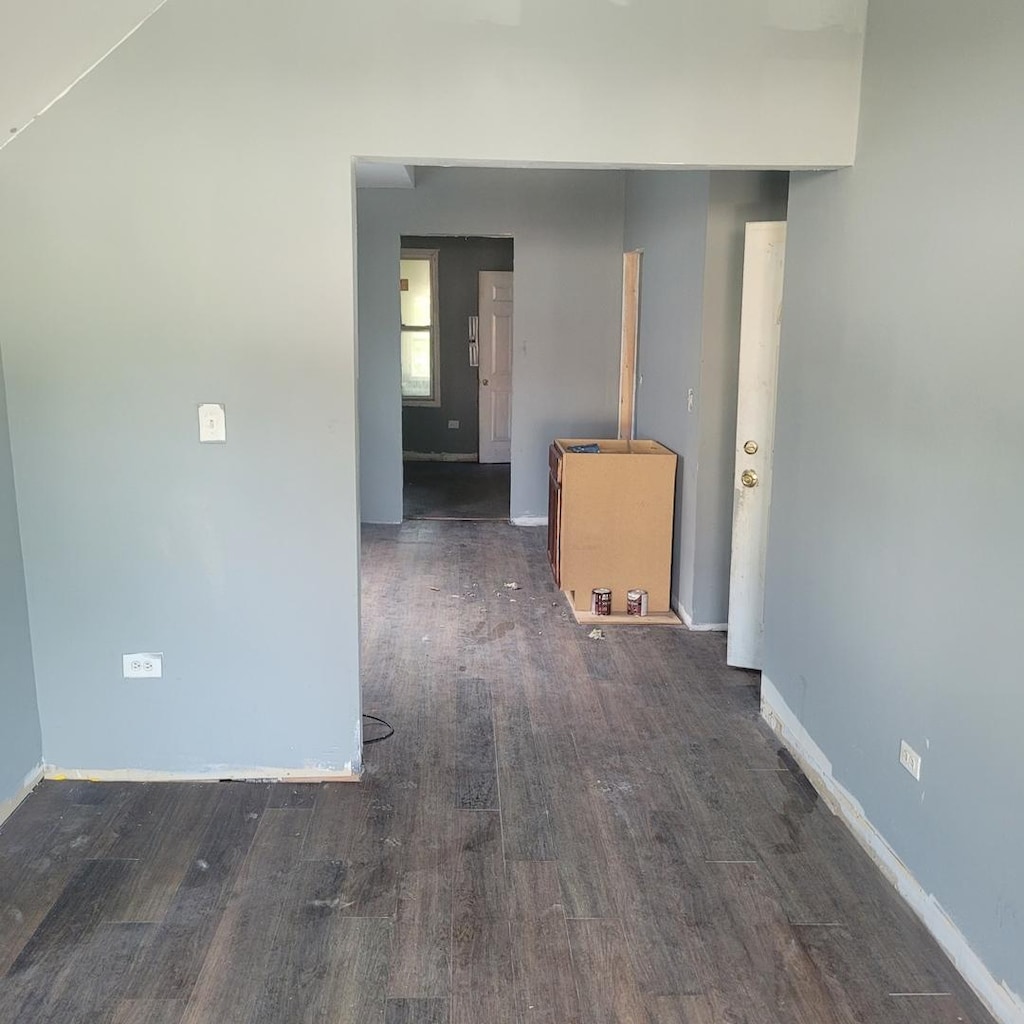 spare room with dark hardwood / wood-style floors