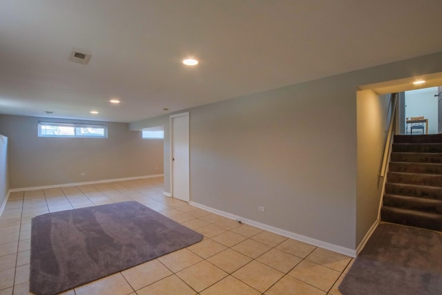 basement with light tile patterned flooring