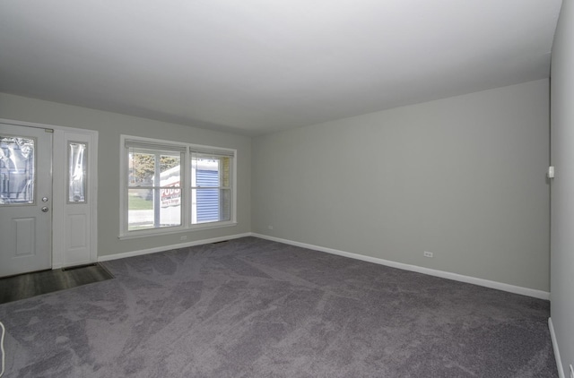 entryway with dark colored carpet