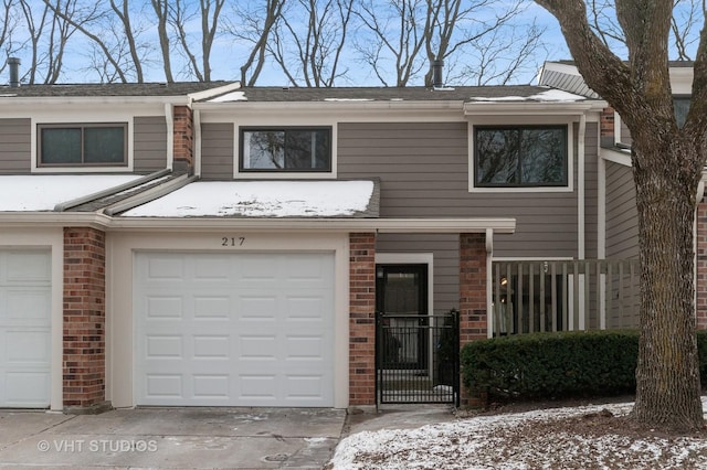 townhome / multi-family property featuring a garage