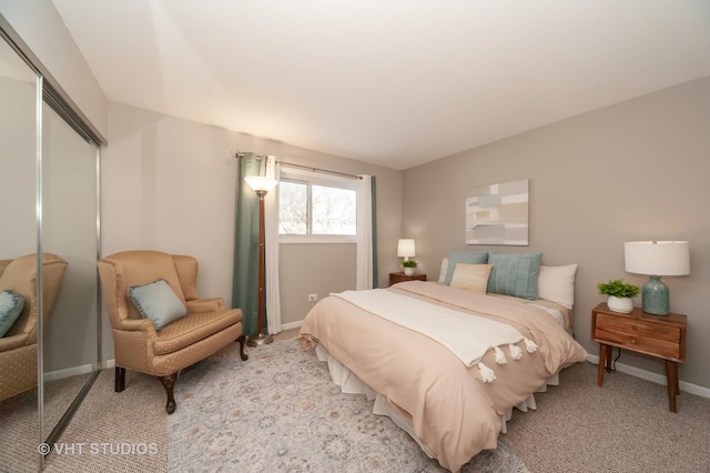 carpeted bedroom with a closet