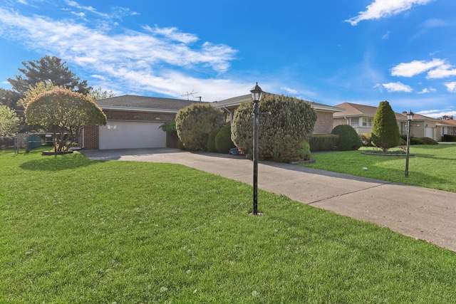4850 N Crescent Ave, Norridge, IL 60706 - view of front facade with an attached garage, brick siding, driveway, and a front yard
