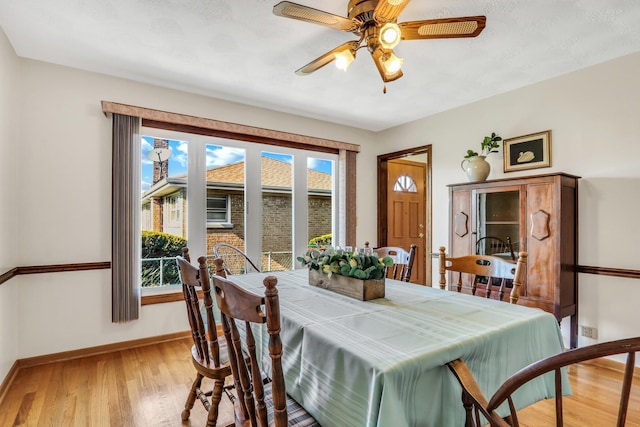 4850 N Crescent Ave, Norridge, IL 60706 - dining area with baseboards, light wood-style floors, and ceiling fan