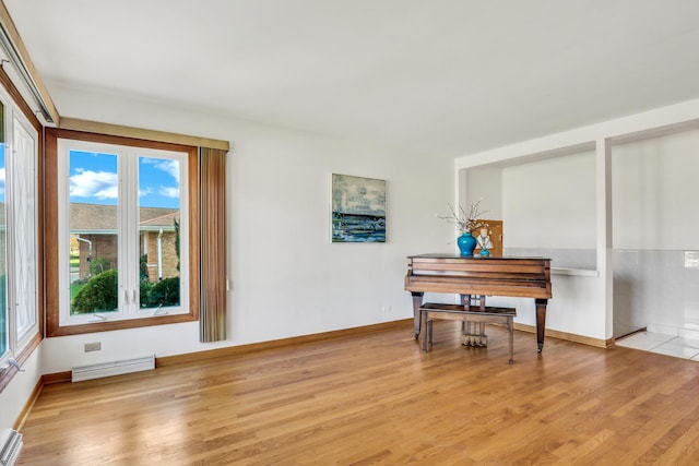4850 N Crescent Ave, Norridge, IL 60706 - sitting room with baseboards, baseboard heating, light wood-style flooring, and visible vents