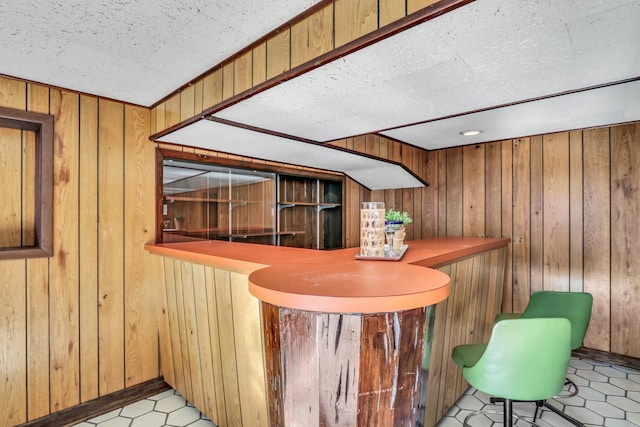 4850 N Crescent Ave, Norridge, IL 60706 - bar with a bar, a textured ceiling, and wooden walls
