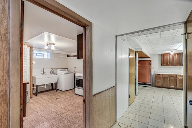 4850 N Crescent Ave, Norridge, IL 60706 - hall with a sink, light tile patterned flooring, and washer and dryer
