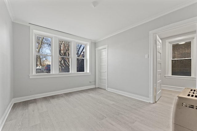 unfurnished room with light hardwood / wood-style floors and ornamental molding