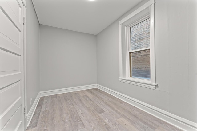 empty room featuring light hardwood / wood-style flooring and a healthy amount of sunlight