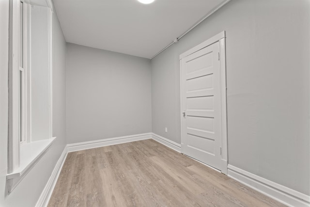 unfurnished room with light hardwood / wood-style floors