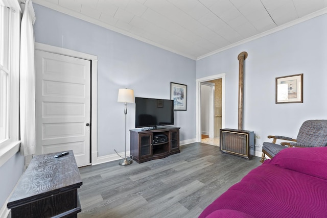 living room with crown molding and hardwood / wood-style floors