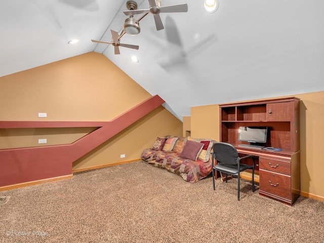 carpeted home office with ceiling fan and lofted ceiling