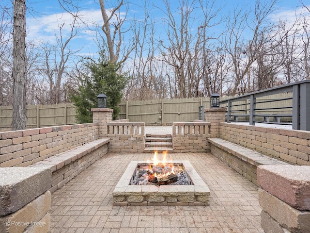 view of patio / terrace with a fire pit