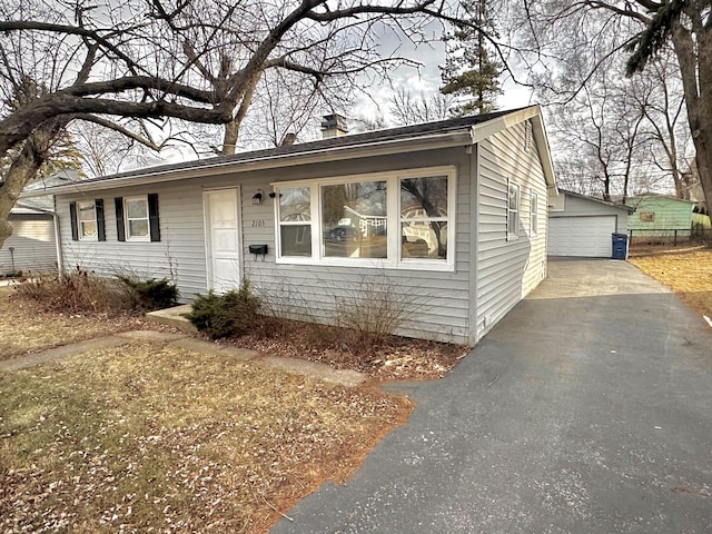 view of front of house with an outbuilding and a garage