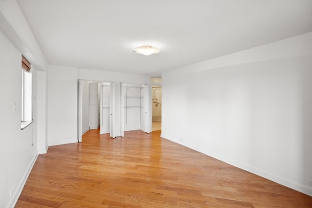 unfurnished bedroom featuring light wood-type flooring