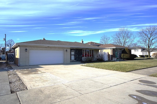 ranch-style house with a garage and a front yard