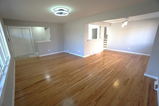 unfurnished room with wood-type flooring