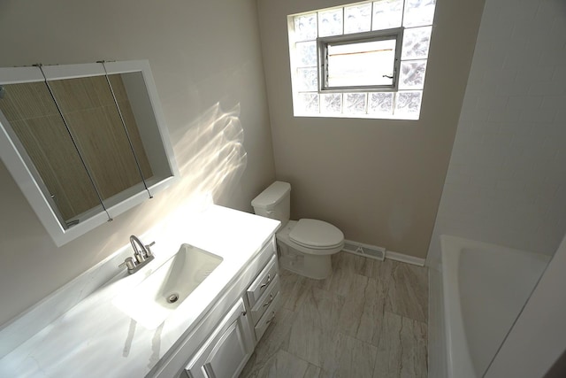 full bathroom featuring independent shower and bath, toilet, and vanity