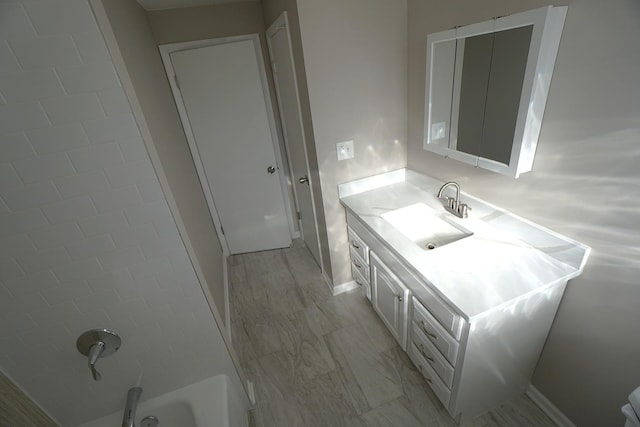 bathroom featuring vanity and tub / shower combination