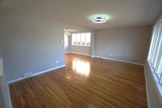 spare room with hardwood / wood-style flooring