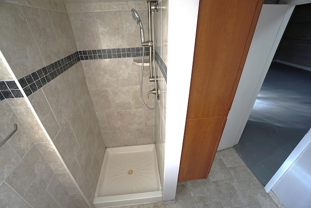 bathroom with tiled shower