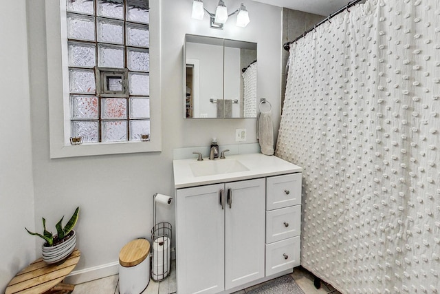 bathroom featuring tile patterned floors, a wealth of natural light, and vanity