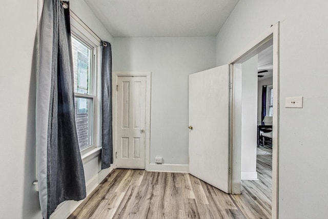 hall with light wood-type flooring