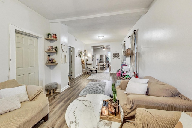 living room with ceiling fan and hardwood / wood-style floors