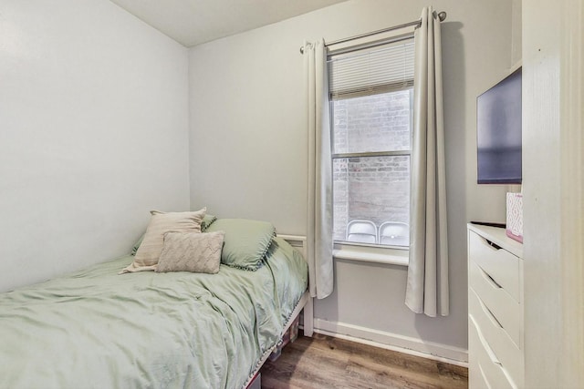 bedroom featuring hardwood / wood-style flooring