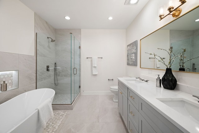 full bathroom with vanity, toilet, and separate shower and tub