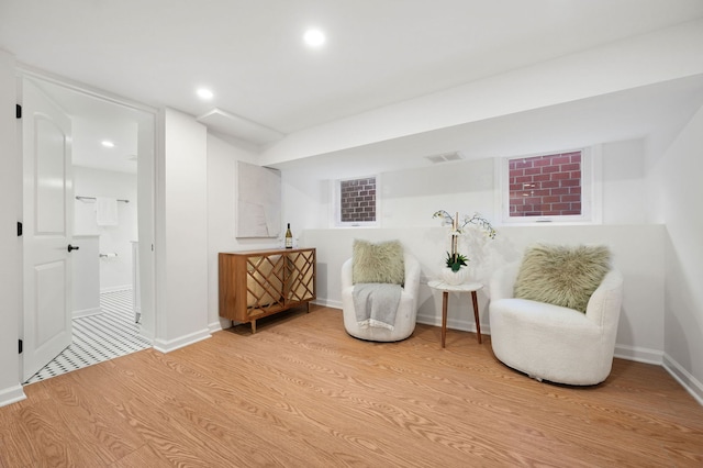 sitting room with light hardwood / wood-style floors