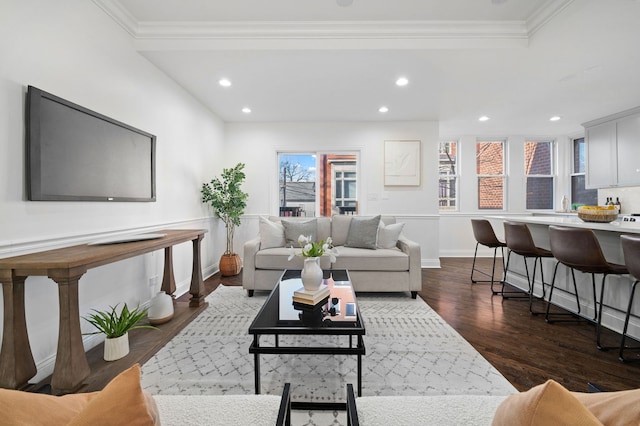 living room with crown molding and dark hardwood / wood-style floors