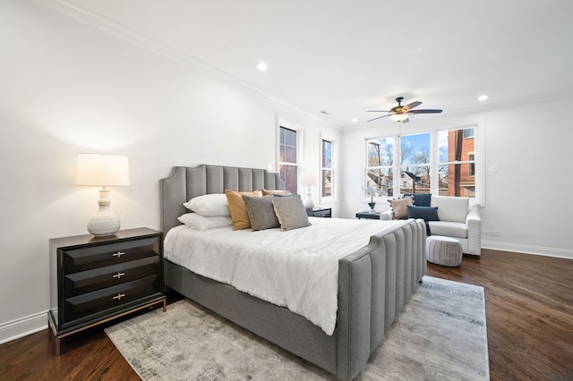 bedroom with ornamental molding, hardwood / wood-style floors, and ceiling fan