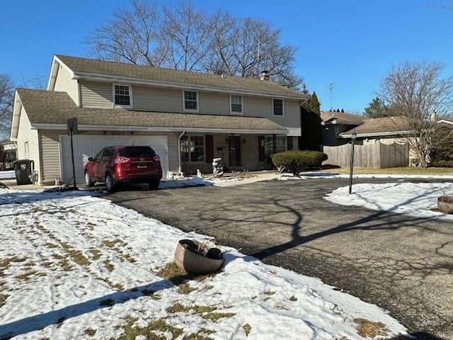 view of front of property featuring a garage and covered porch