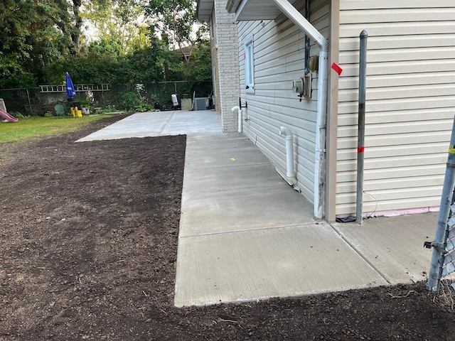 view of side of property with a patio area