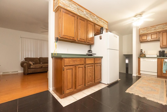 kitchen featuring ceiling fan, light tile patterned floors, and white appliances